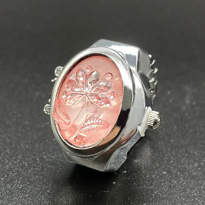 bague montre à clapet fermé rose fleur acier