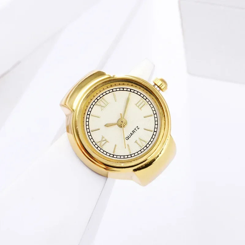 bague montre femme vintage ajustable acier or chiffres romains sur support blanc