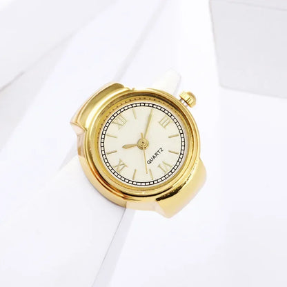 bague montre femme vintage ajustable acier or chiffres romains sur support blanc